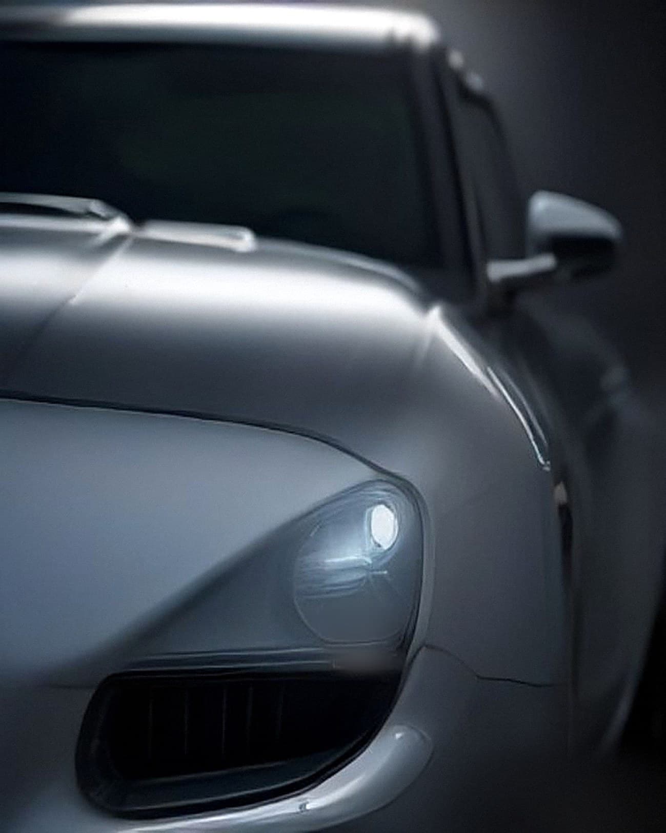 Close-up of a car’s headlight and bonnet
